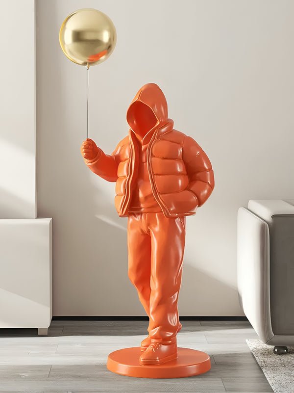 Hooded Street Abstract Human Holding Balloon Floor Statue - Orange