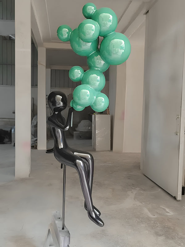 Abstract Character Sitting Blowing Bubbles Statue - Black / Turquoise