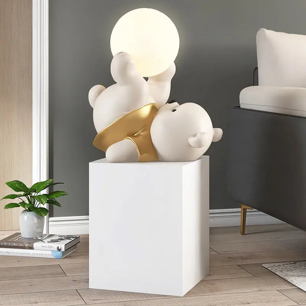 Bear Upside Down Holding Light Off Floor Statue - Golden